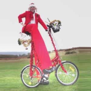 Giant Christmas Bike and stiltwalker